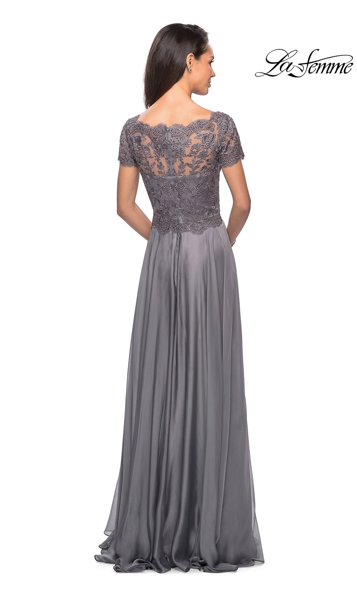 Woman wearing the Long Formal Dress: La Femme 27098—floor-length gray with a lace embroidered bodice and short sleeves, back to camera; “La Femme” logo at top right.
